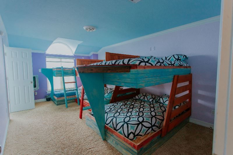 There is a bunk bed in the middle of the room.