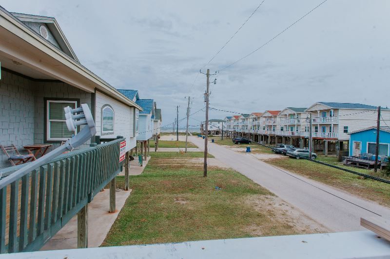 A view of a row of houses from a balcony.