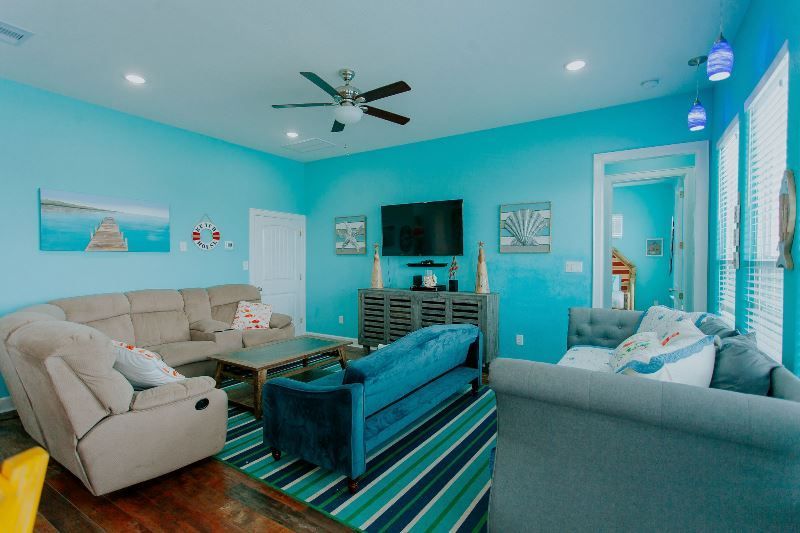 A living room filled with furniture and a flat screen tv.