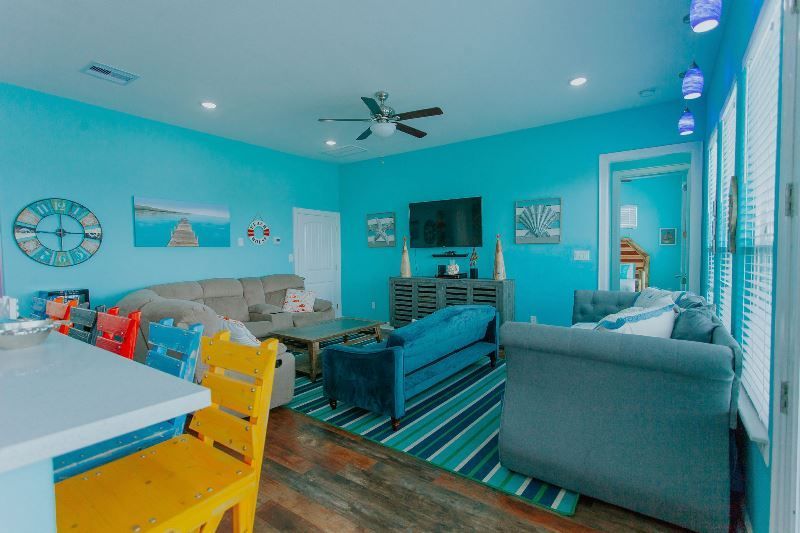 A living room filled with furniture and a flat screen tv.