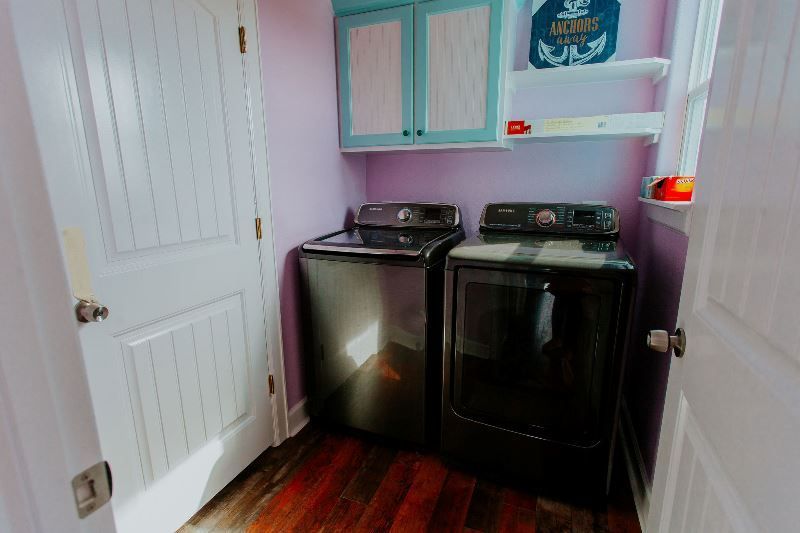 A laundry room with a washer and dryer in it.