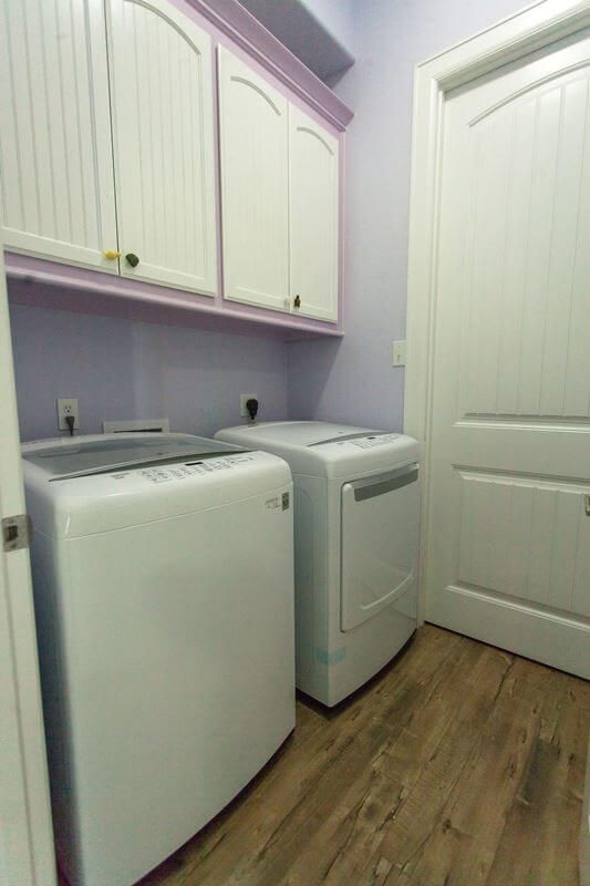 A laundry room with a washer and dryer in it