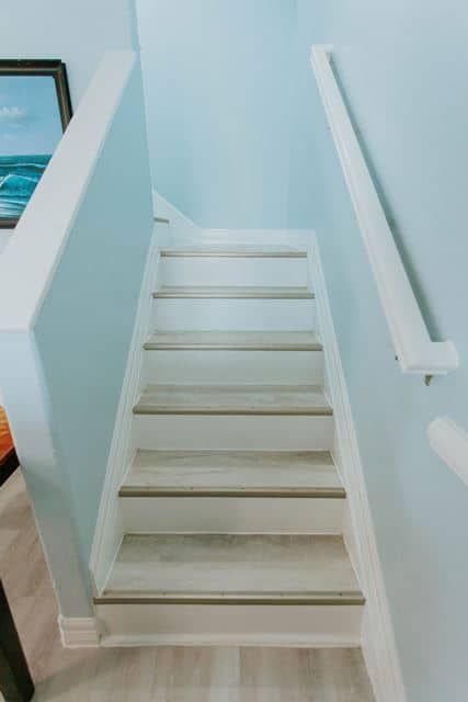 A set of stairs leading up to the second floor of a house.