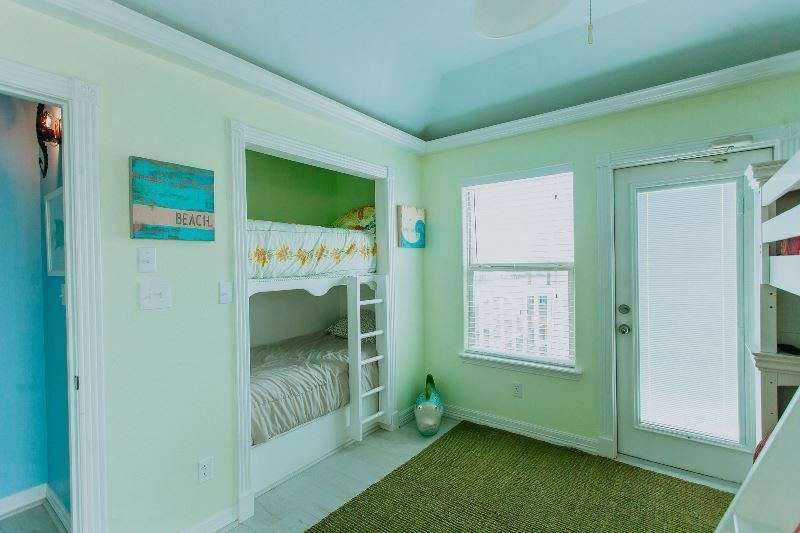 There is a bunk bed in the middle of the room.