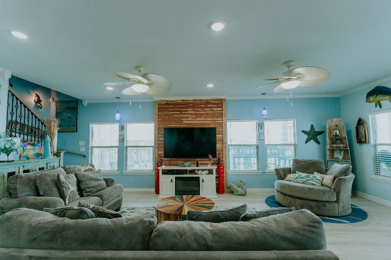A living room filled with furniture and a flat screen tv.