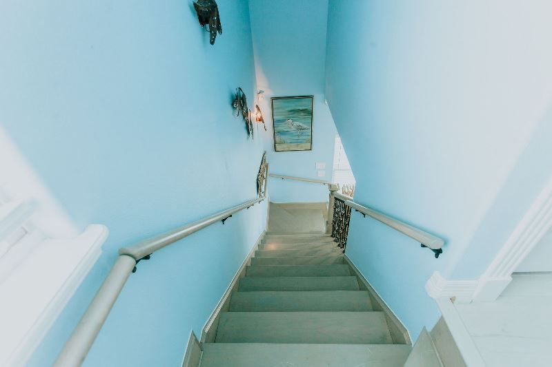 A set of stairs leading up to the second floor of a house.