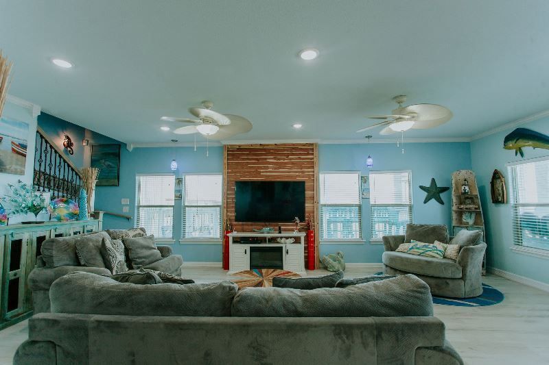 A living room filled with furniture and a flat screen tv.