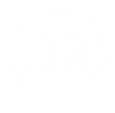 White logo with "DR" inside a circle of text that's difficult to read.