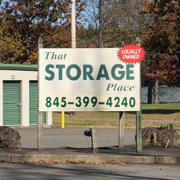 A man in a cowboy hat is standing in front of a garage.