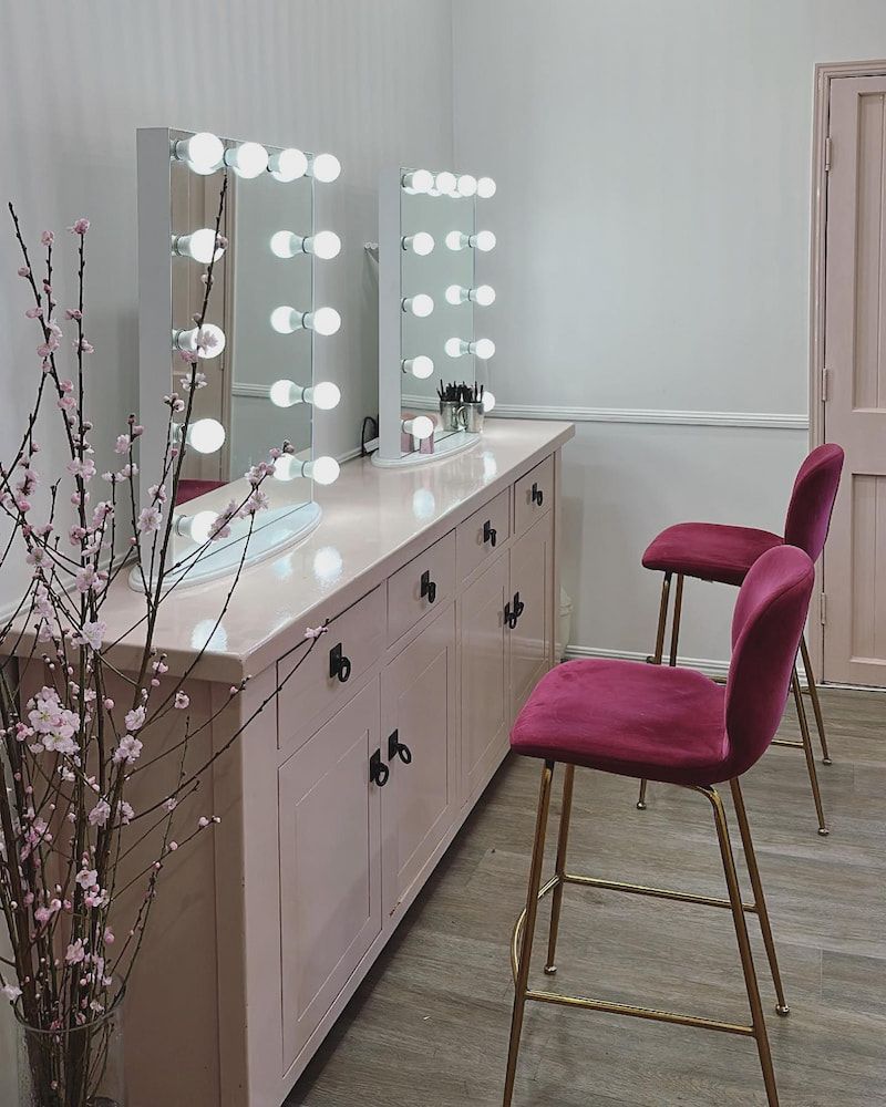 A Dressing Room With Two Chairs and Two Mirrors — Erikka's All Occasion Beauty In Rockhampton City, QLD