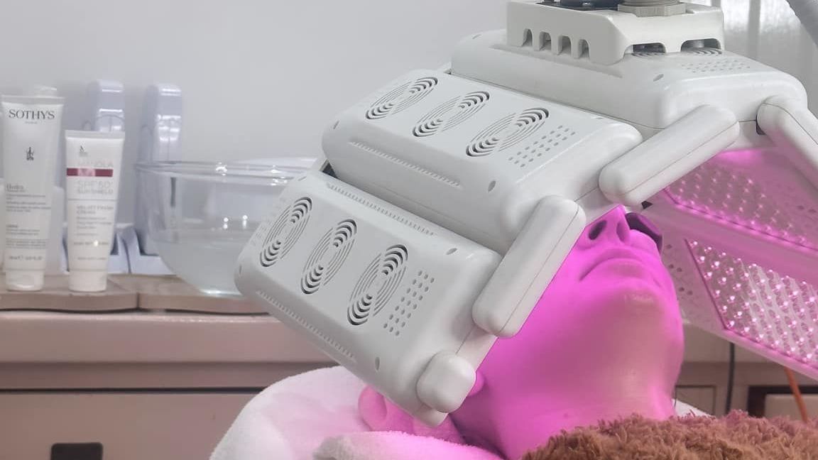 A Woman is Getting a Facial Treatment in a Beauty Salon — Erikka's All Occasion Beauty In Rockhampton City, QLD