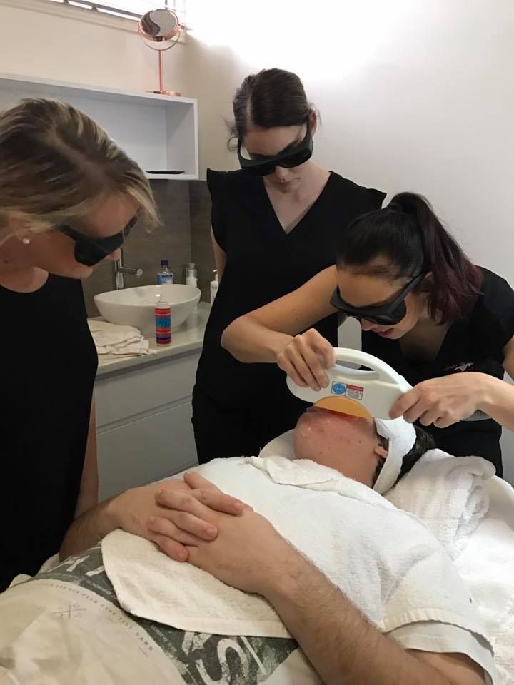 A Man is Getting a Facial Laser Treatment — Erikka's All Occasion Beauty In Rockhampton City, QLD