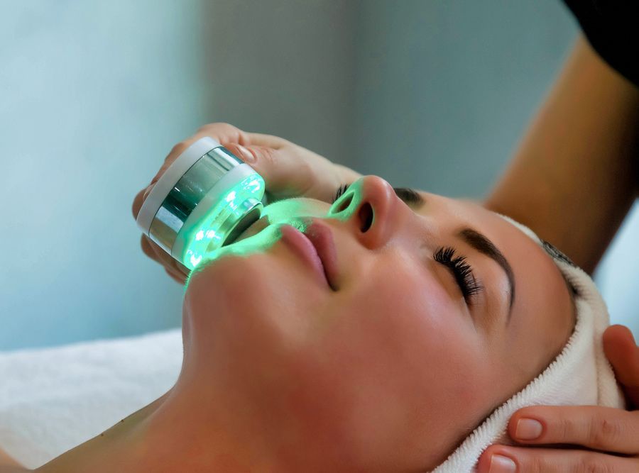 Beautician Doing Facial Led Light Therapy — Erikka's All Occasion Beauty In Rockhampton City, QLD