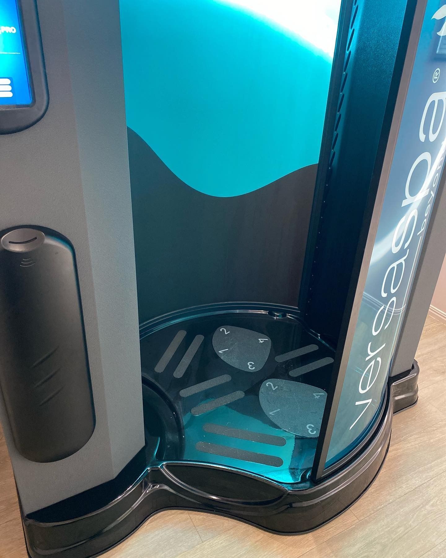 A Tanning Booth With the Word Vertigo on It — Erikka's All Occasion Beauty In Rockhampton City, QLD