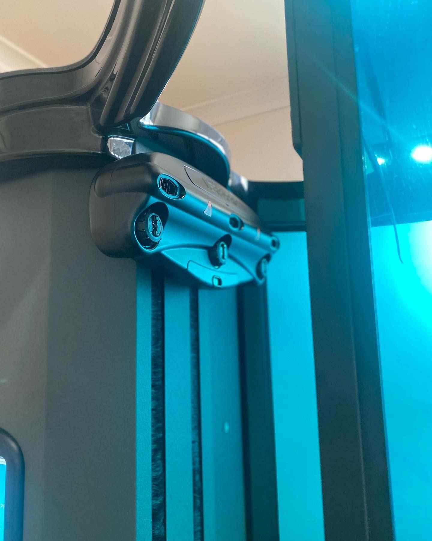 A Close Up of a Tan Machine With the Lid Open — Erikka's All Occasion Beauty In Rockhampton City, QLD