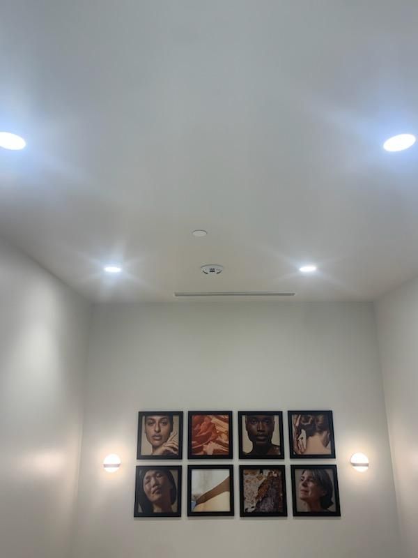 A room with a lot of pictures on the wall