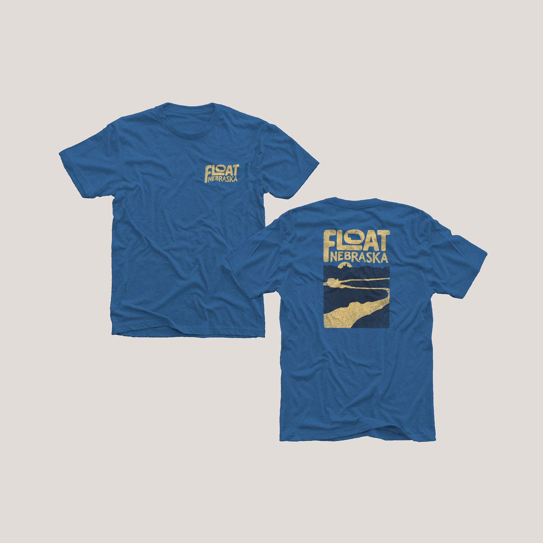 Blue t-shirts with front logo “FLOAT” and back graphic “FLOAT NEBRASKA” over a landscape.
