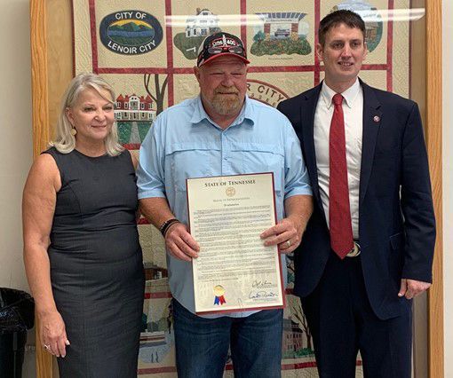 Man Holding Certificate — Greenback, TN — The Lost Vets Rescue