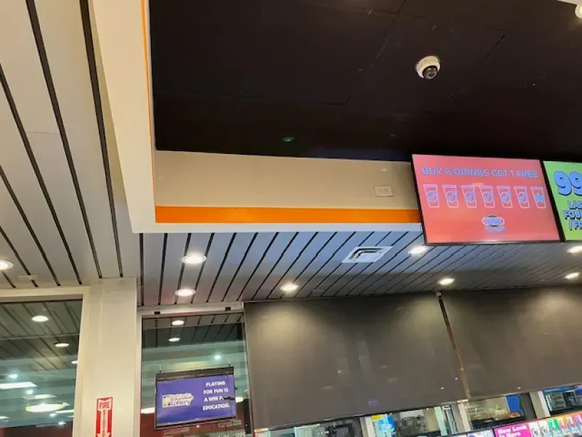 A restaurant with a ceiling that has a sign that says 99 on it.