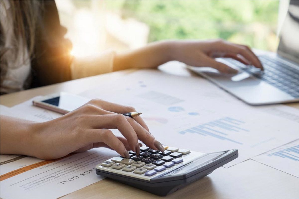 Woman is Typing on a Calculator — Rochdale Accounting & Business Advisory in Alstonville, NSW