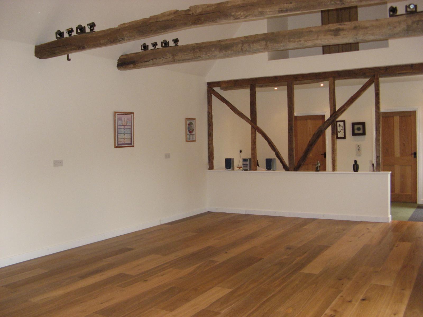 The Balanced Path At The Tai Chi Studio empty studio shot featuring wooden floor and rustic ceiling beams