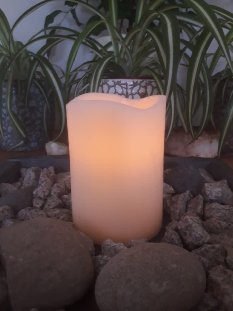 The Balanced Path At The Tai Chi Studio lit candle