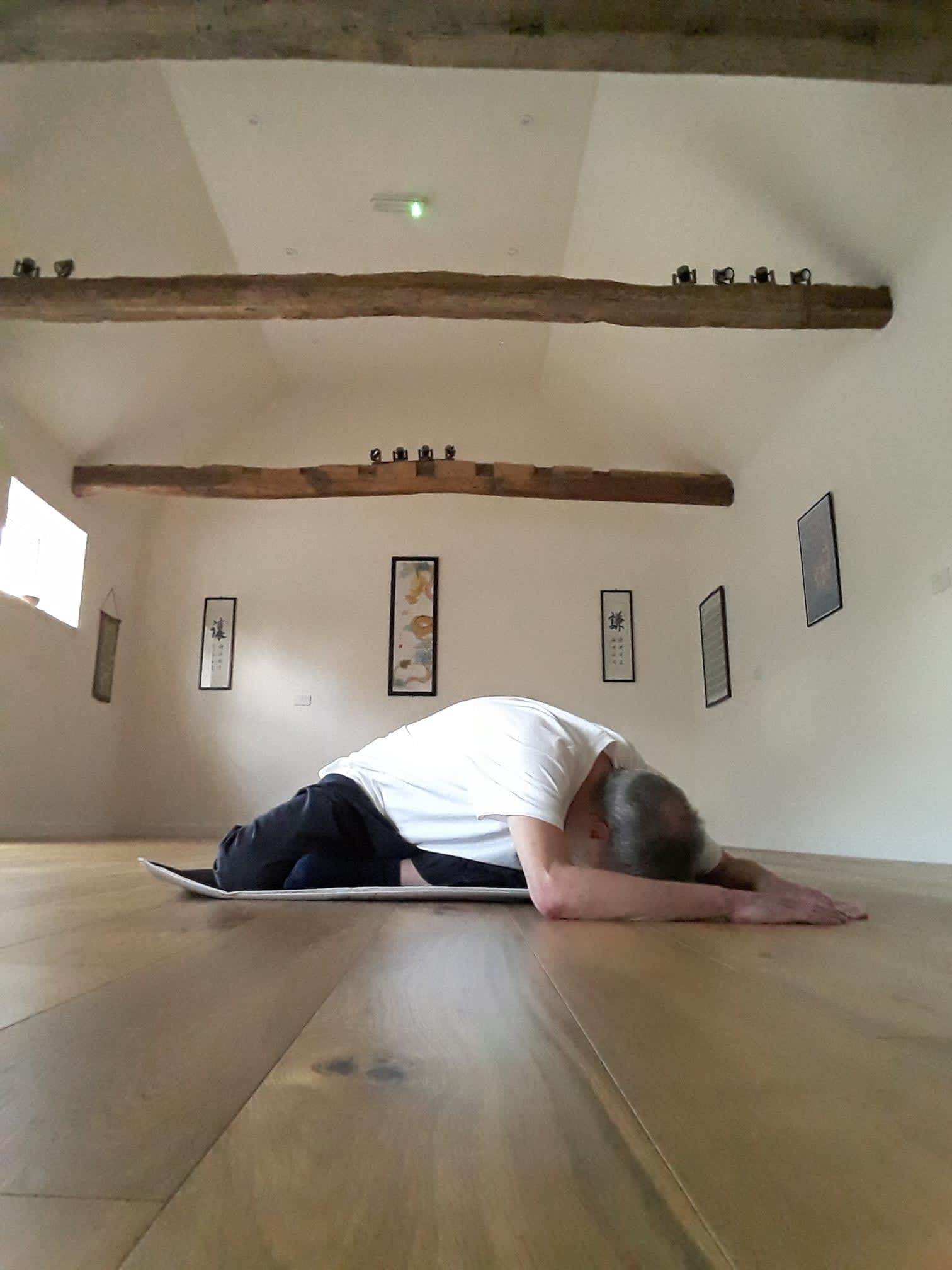 The Balanced Path At The Tai Chi Studio's Dave in tai chi position, head to floor