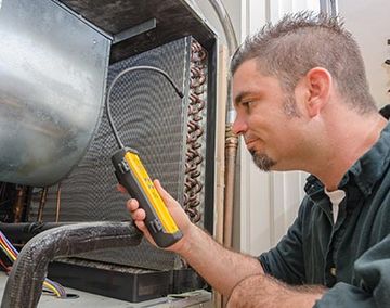 HVAC Technician with Leak Detector — HVAC Repairs in Somerville, NJ