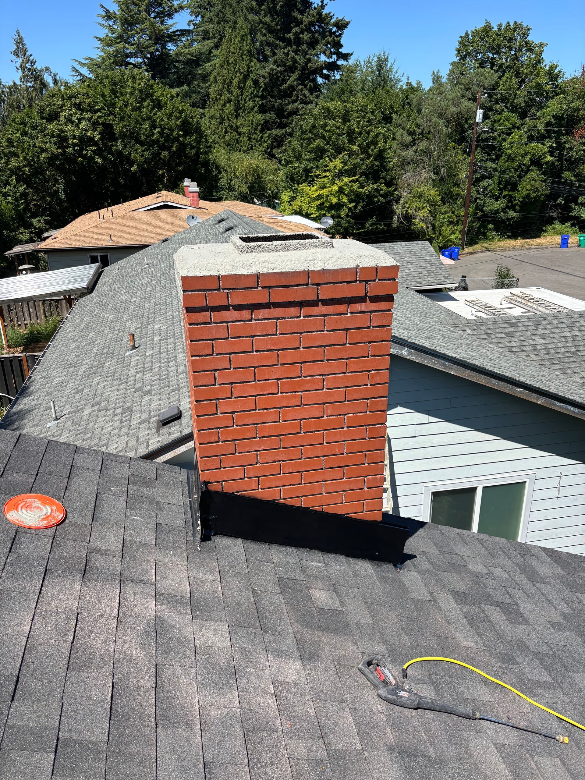 Brick chimney being rebuilt