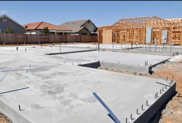 A concrete foundation of a house under construction