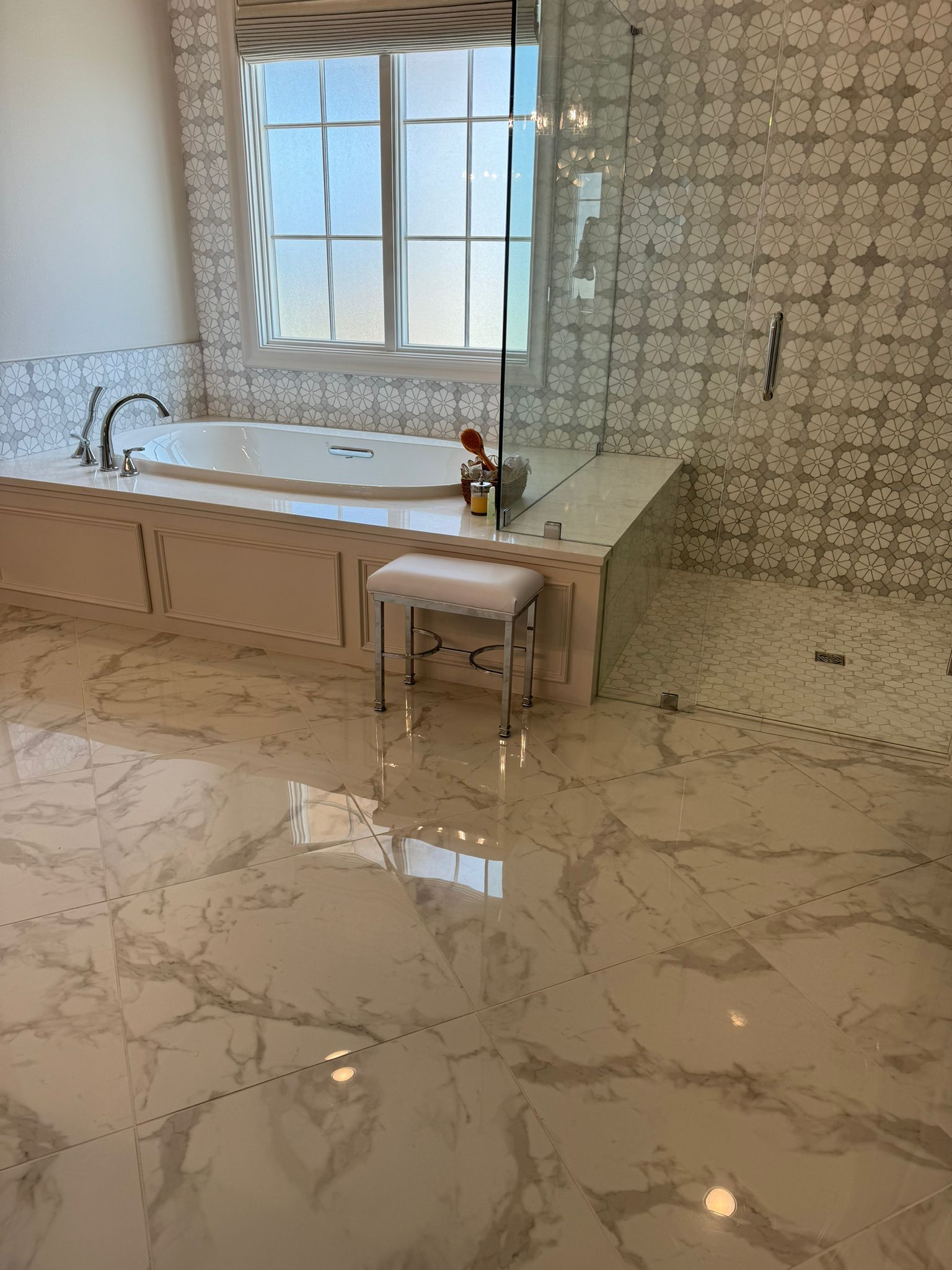 A bathroom with a bathtub and a walk in shower.