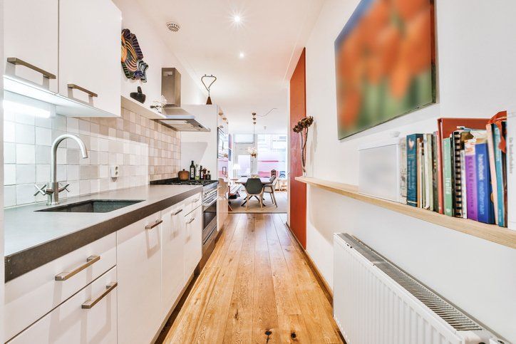 Narrow kitchen with open dining area