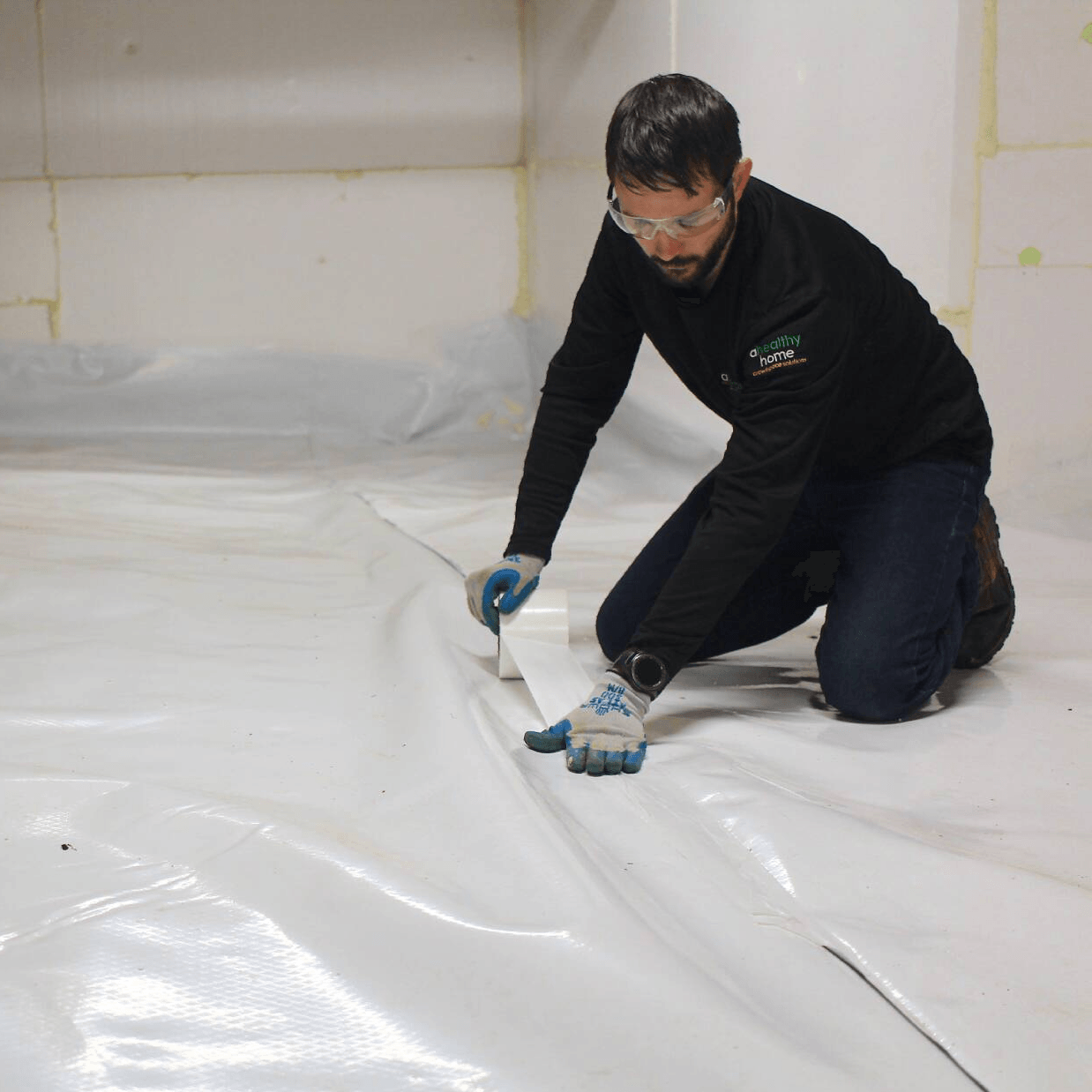 Man Adding Crawlspace Encapsulation — Chapel Hill, NC — A Healthy Home