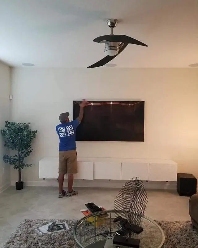 Man Fixing The TV | Tampa, FL | Rob the Brit Home Theaters Inc