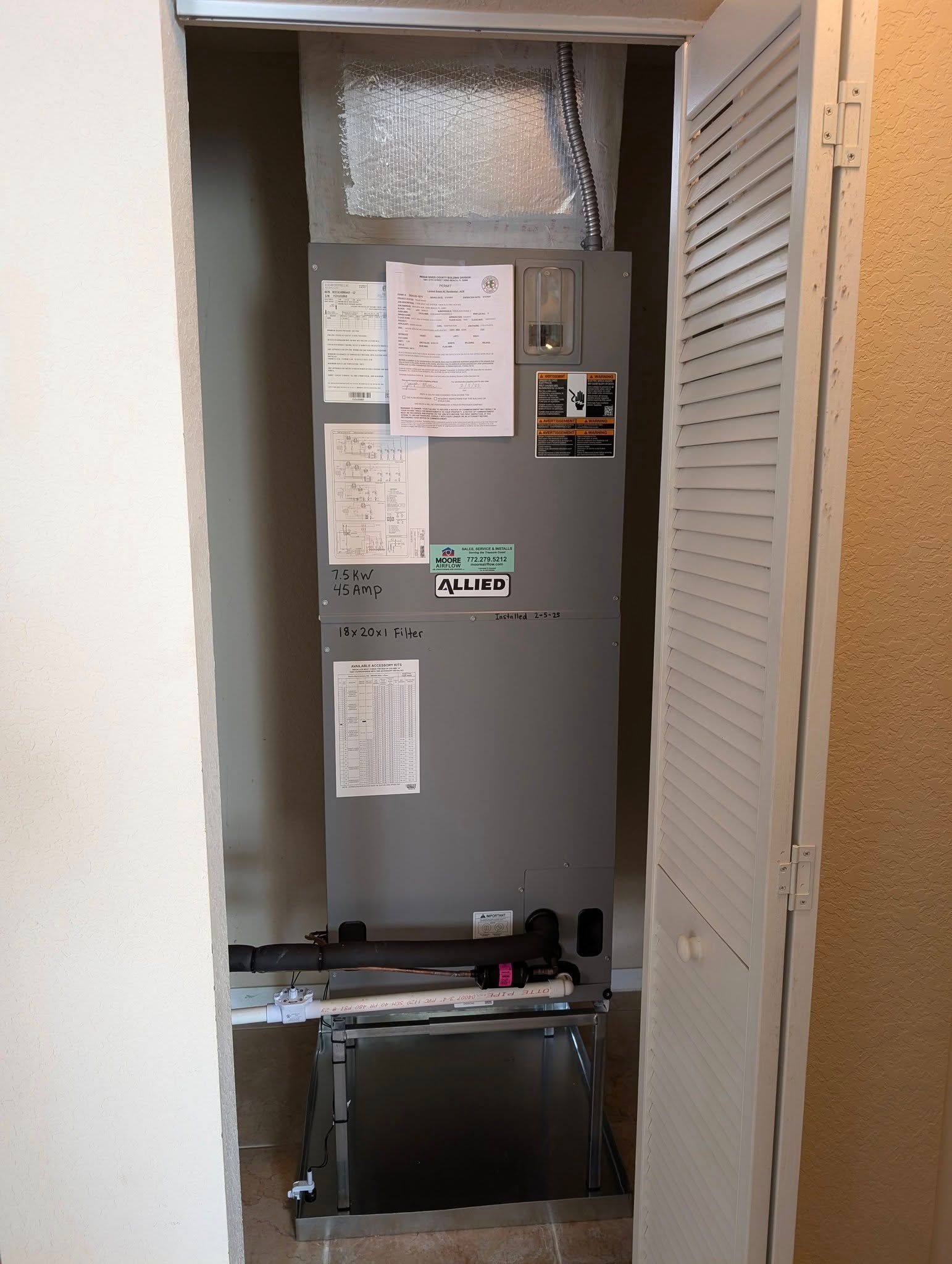 A room with a closet and a heater in it