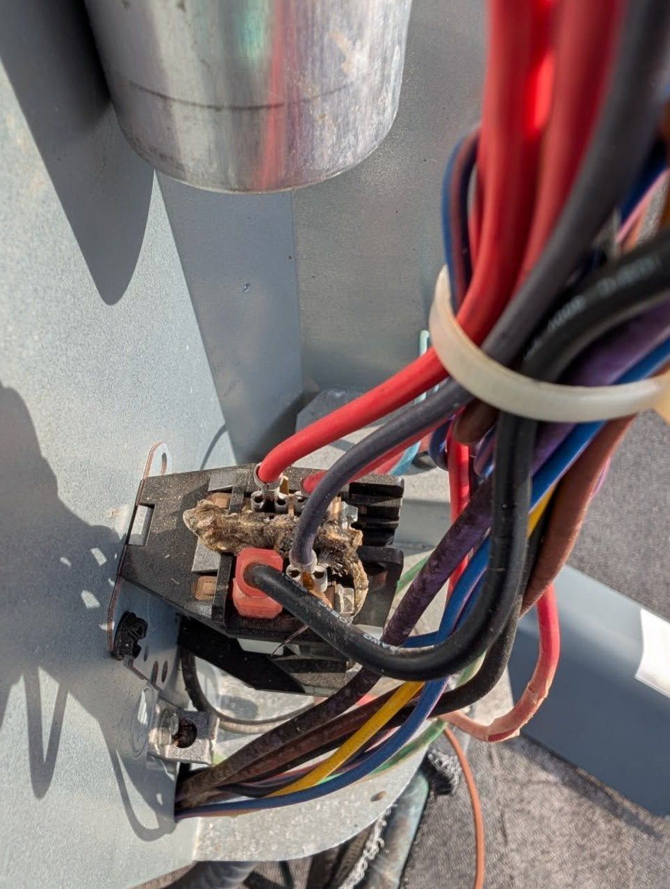 A bunch of wires are connected to a metal object