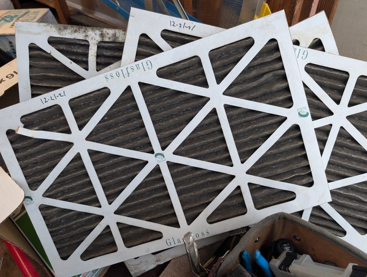 A bunch of filters are stacked on top of each other on a table.