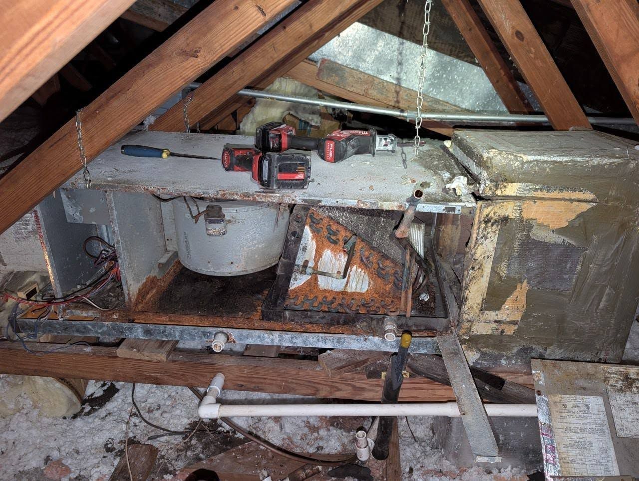 A wooden attic with a few tools on it