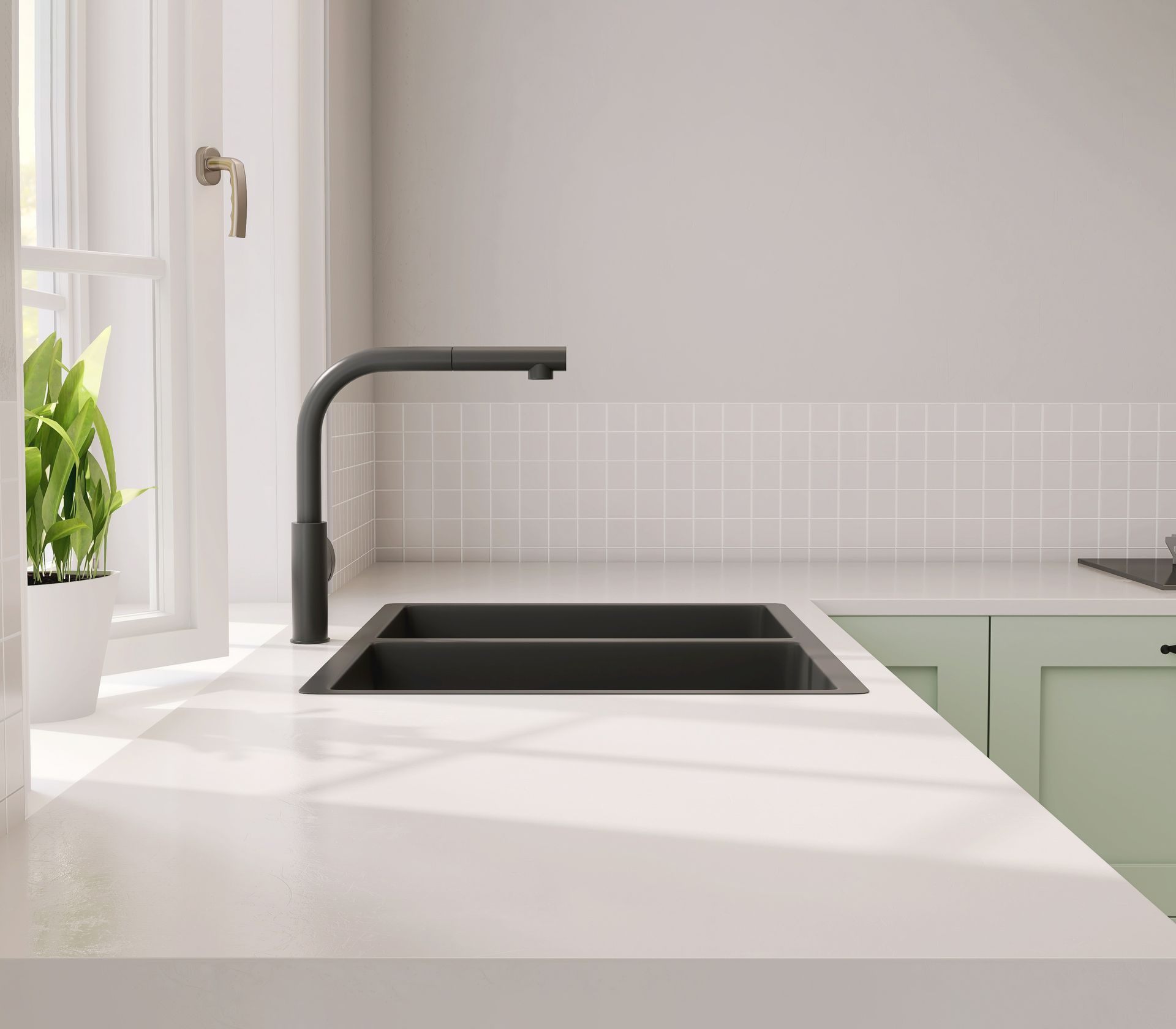 Kitchen sink with a dark faucet, white countertop, and light green cabinets.