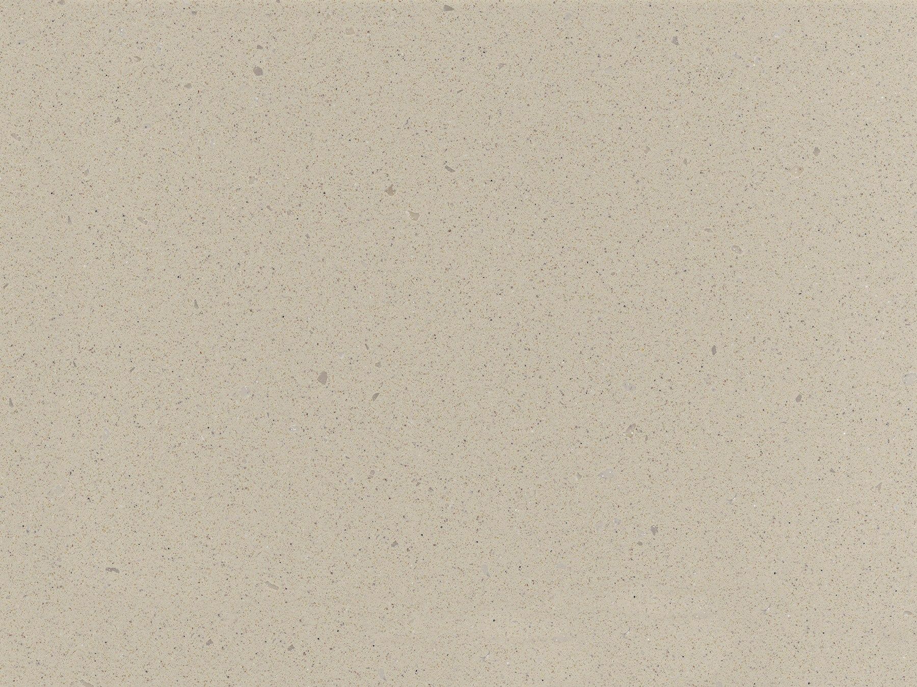 Textured beige surface with small, dark flecks.