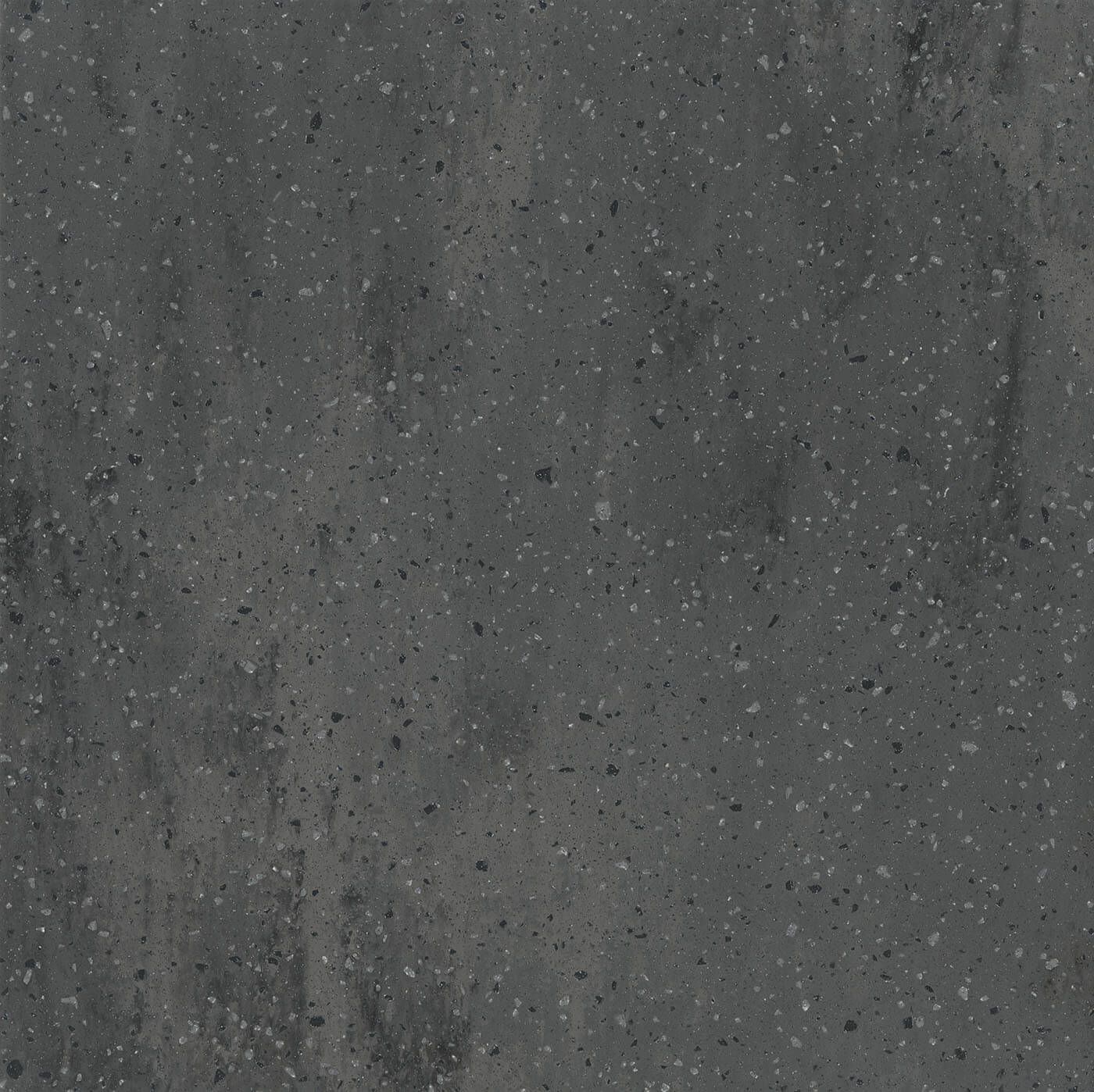 Dark gray speckled surface with subtle vertical streaks.