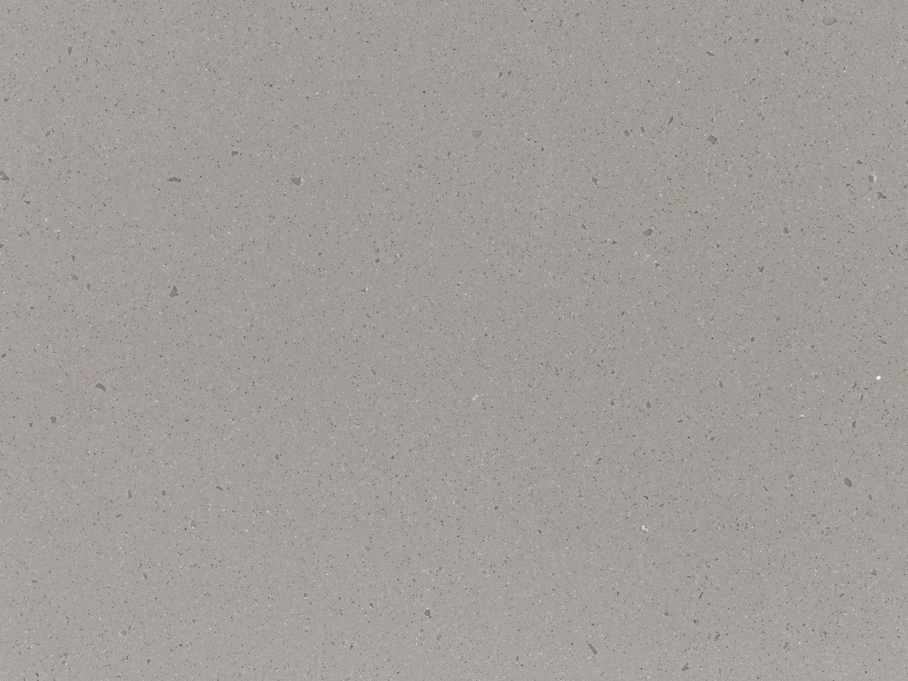 Gray speckled quartz countertop surface.