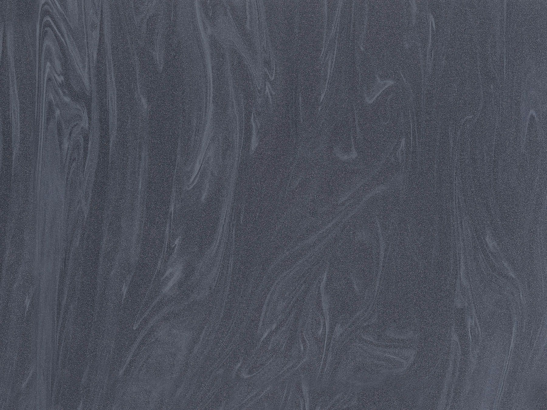 Dark gray stone texture with subtle swirling patterns.