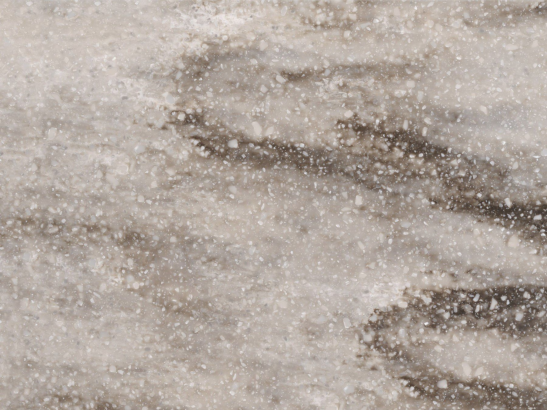 Textured surface with light and dark gray swirled patterns, speckled with tiny white particles.