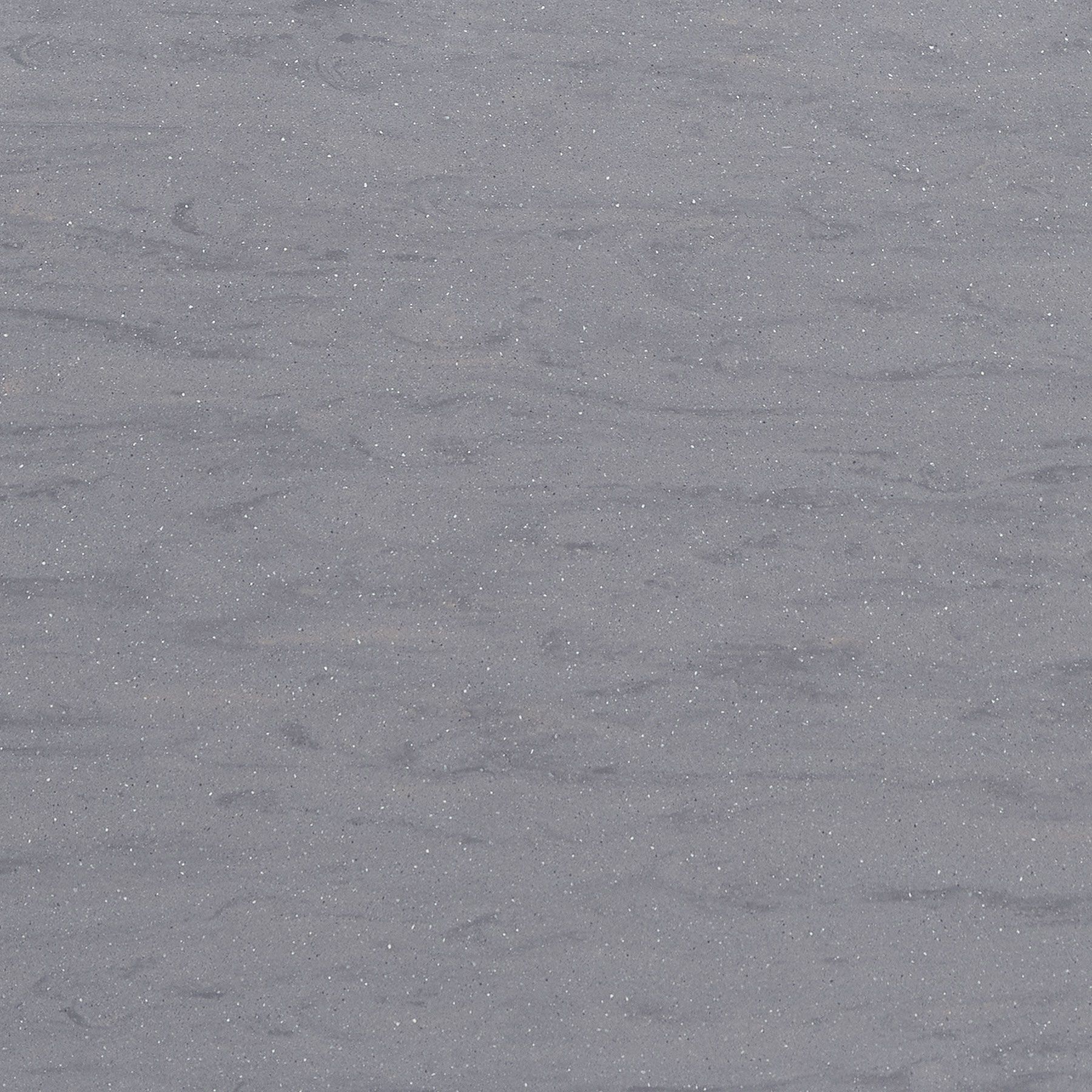 Gray quartz countertop with subtle horizontal veining and sparkling flecks.