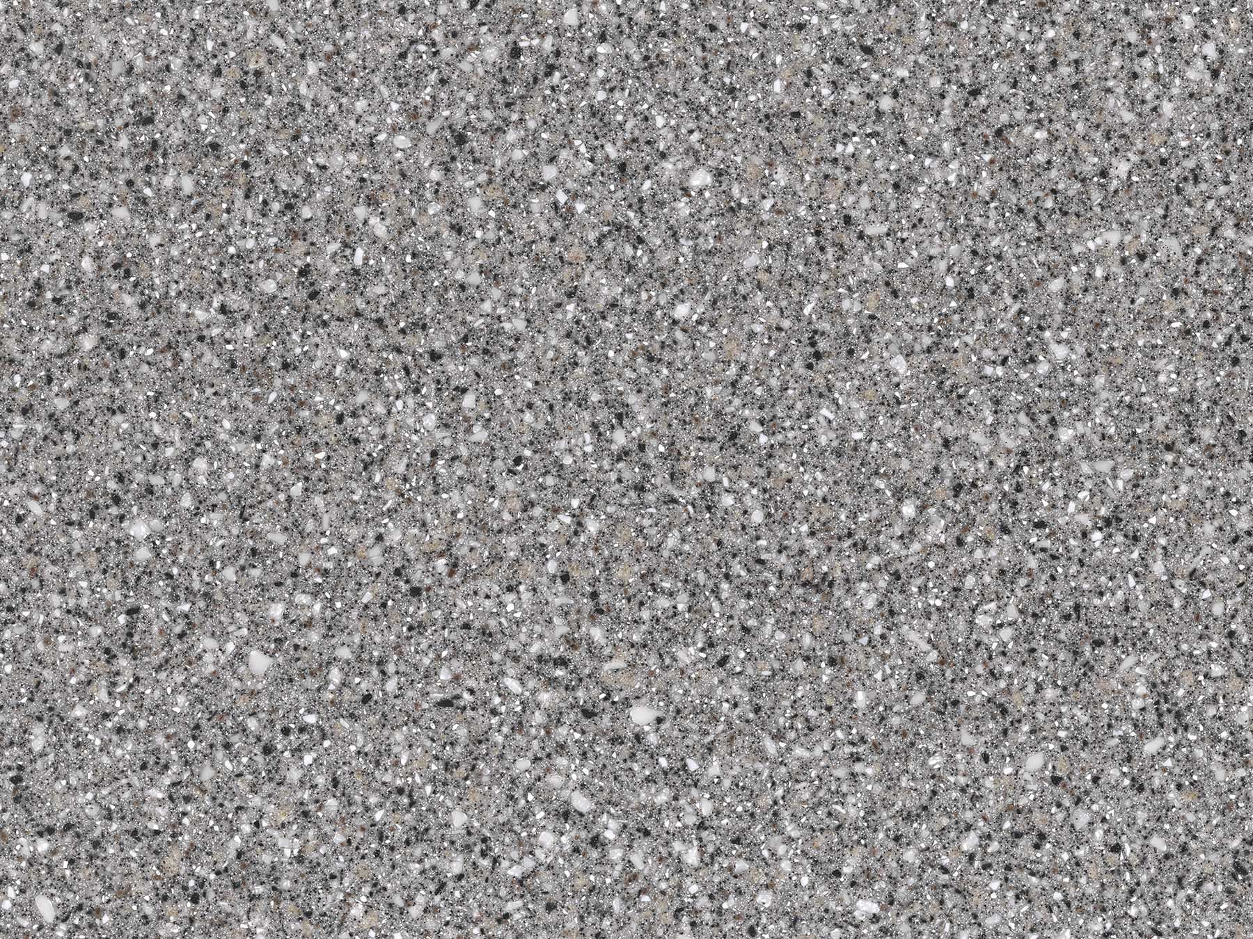 Close-up of a gray speckled surface, possibly granite or a similar stone texture.