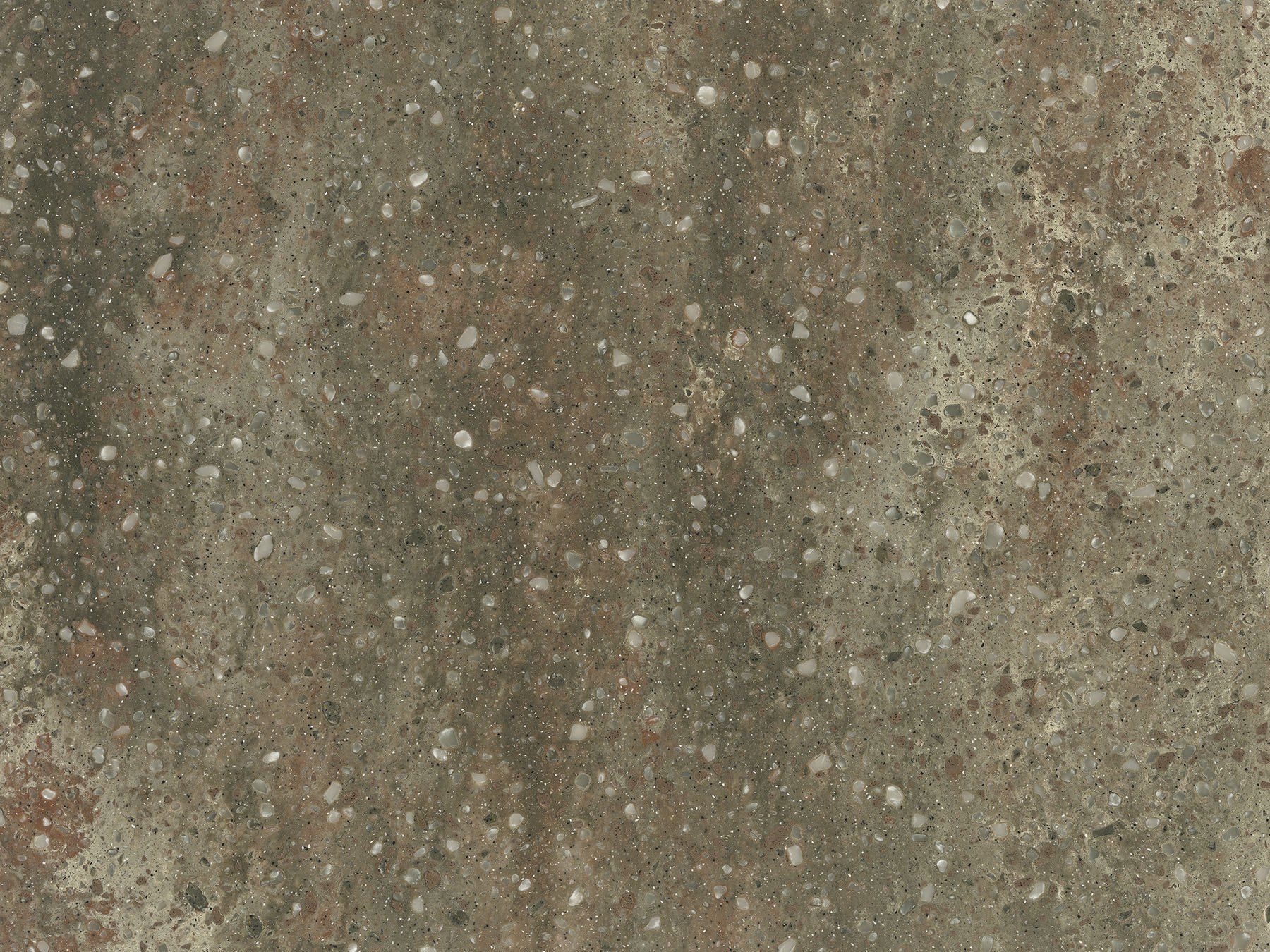 Gray, speckled surface with white and brown flecks, resembling concrete or stone.