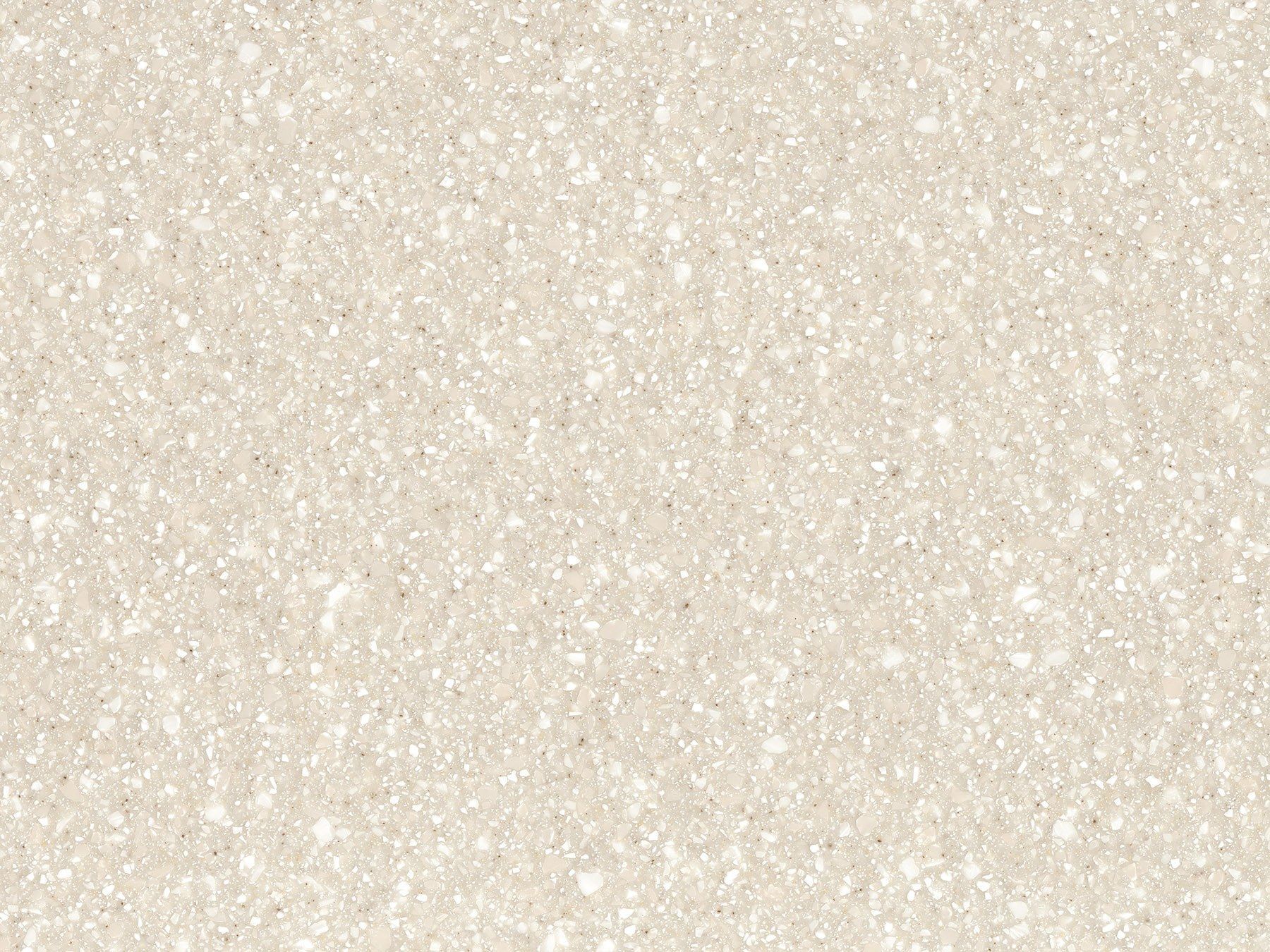 Beige speckled surface, resembling a countertop or tile.