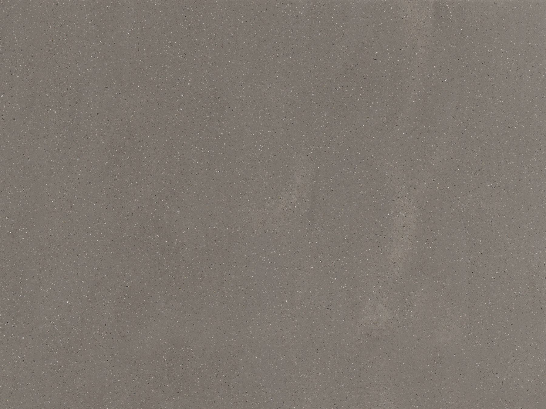 Gray speckled surface, possibly stone or composite material.