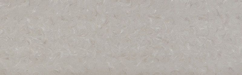 Pale, textured surface with vertical striations, possibly fabric or paper.